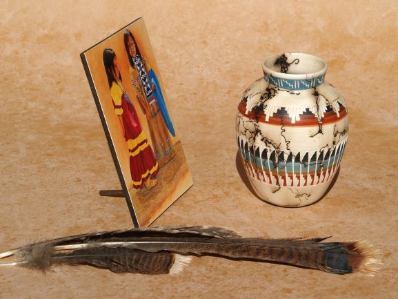Native American mini art print on a mini panel by Ted Sorensen displayed with a decorative pottery vase and feathers