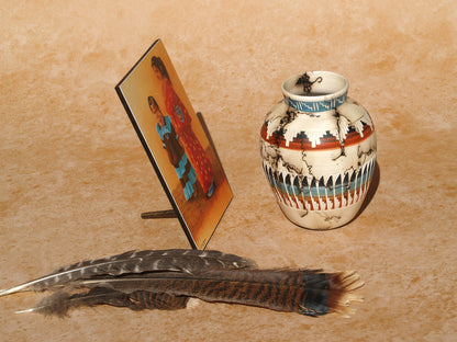 Native American art mini panel featuring traditional dress and pottery with decorative feathers