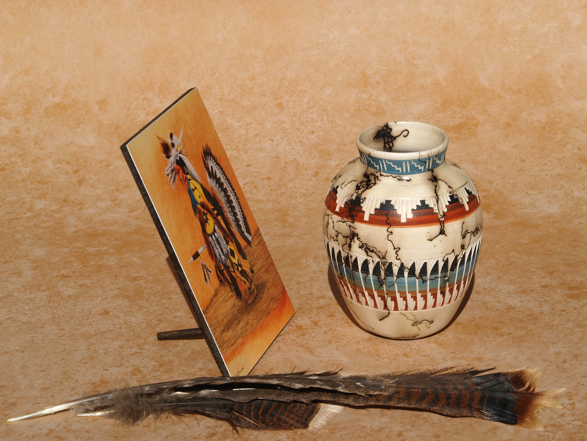 Native American mini art panel by Ted Sorensen with pottery vase and feather on tan background