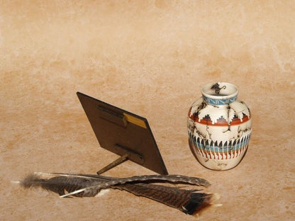 Southwestern mini panel art by Ted Sorensen displayed with ceramic vase and feathers on textured surface