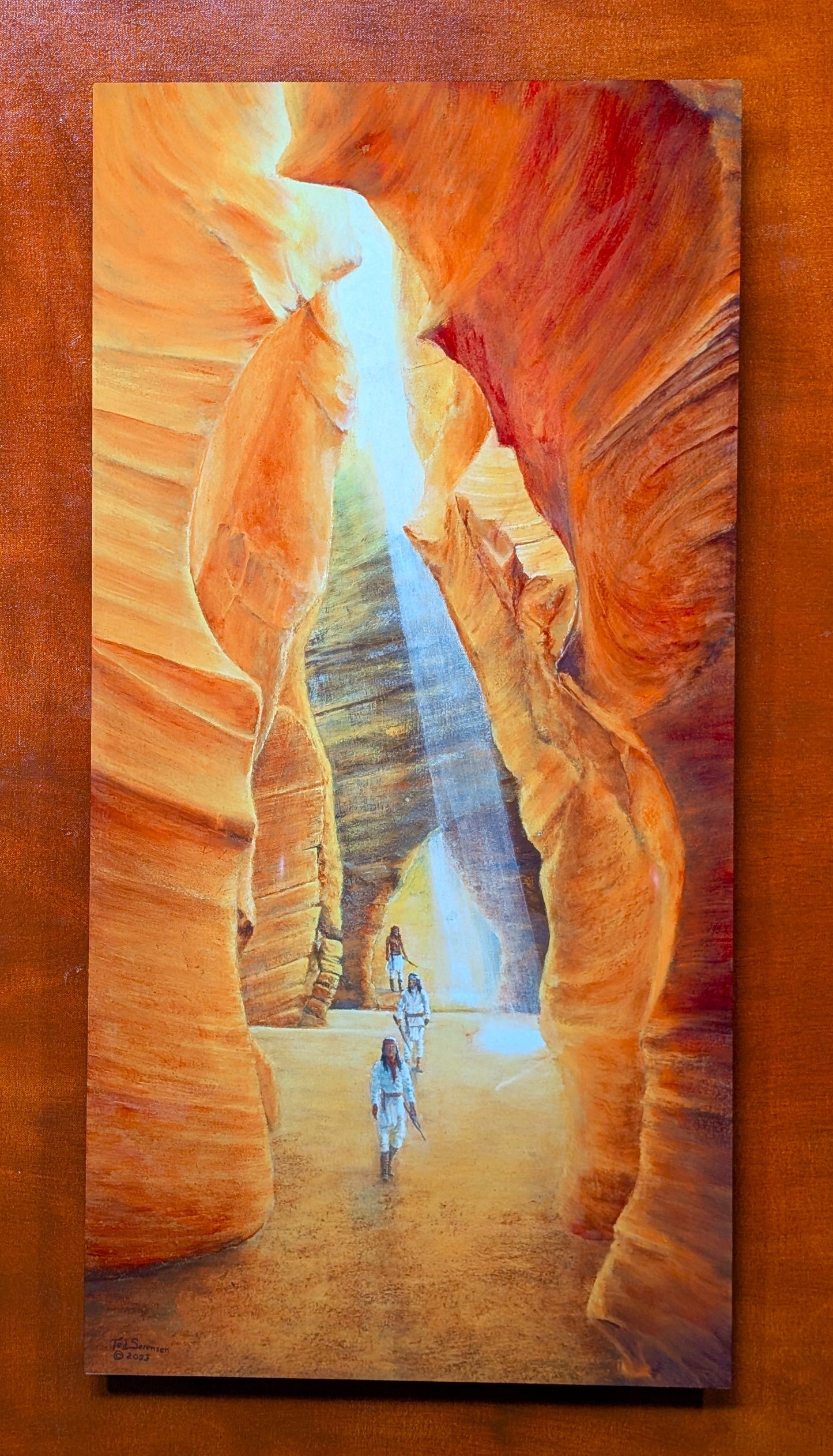 Ted Sorensen western art metal print depicting warriors walking through a sunlit canyon with orange rock walls