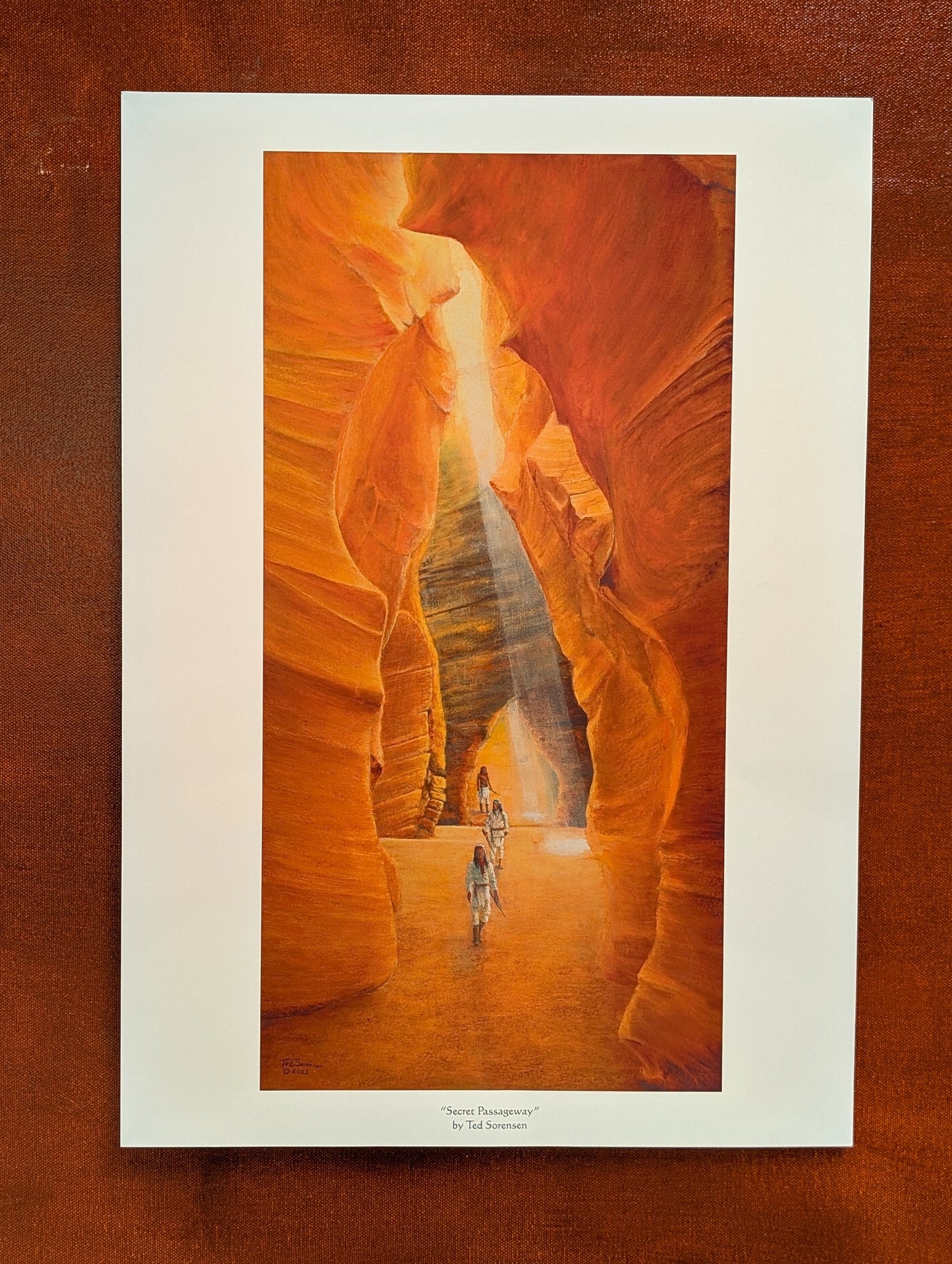 Western art open edition print by Ted Sorensen showing Indian warriors in a sunlit narrow canyon